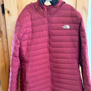 The North Face women’s dark red coat.